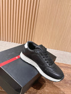 Prada unisex sneakers in black leather, lace-up with white rubber sole