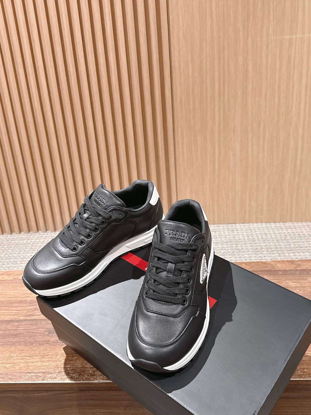 Prada unisex sneakers, black leather with lace-up and white sole