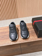Prada unisex leather sneakers, black with lace-up front and white sole