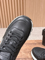 Prada unisex sneakers, black leather upper with laces and textured toe cap