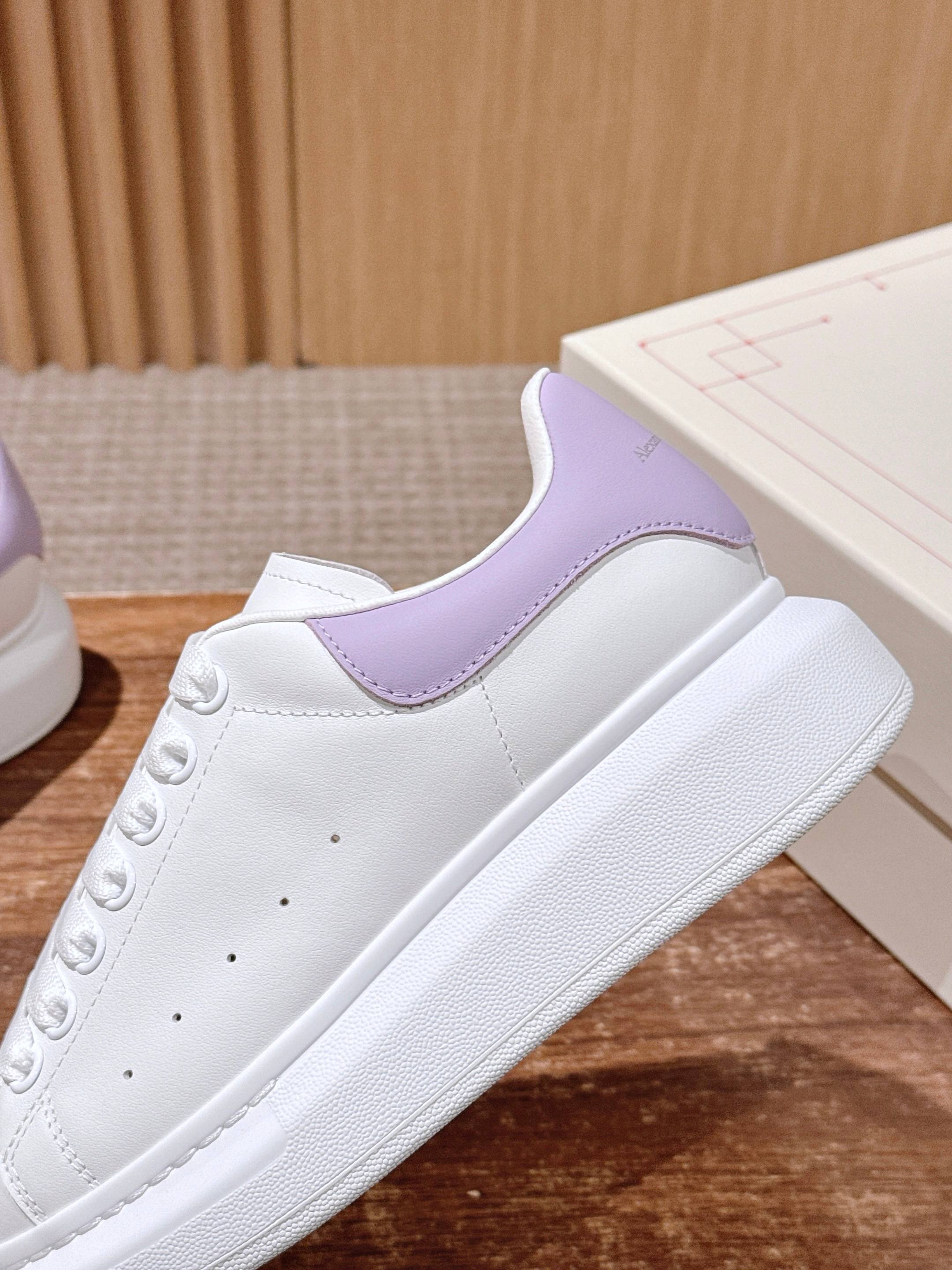 White leather sneaker with lavender quarter panel and lace-up design