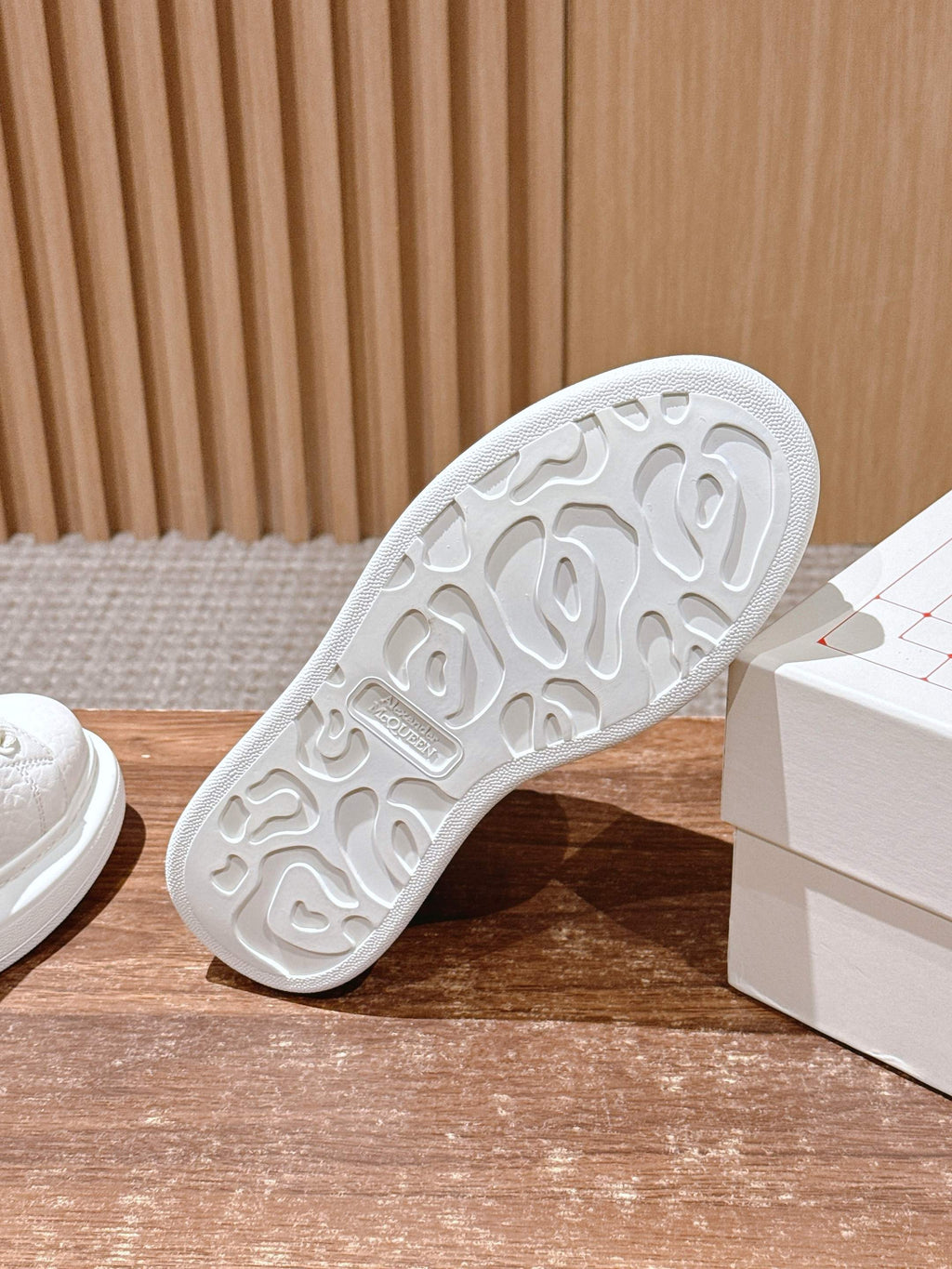 White sneaker outsole with raised tread pattern