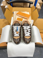 Unisex monogram lace-up sneakers with white laces and brown rubber sole