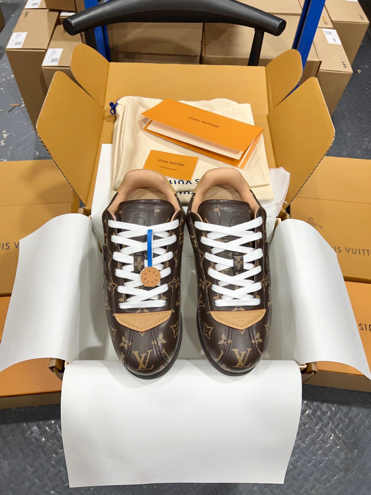 Unisex monogram lace-up sneakers with white laces and brown rubber sole