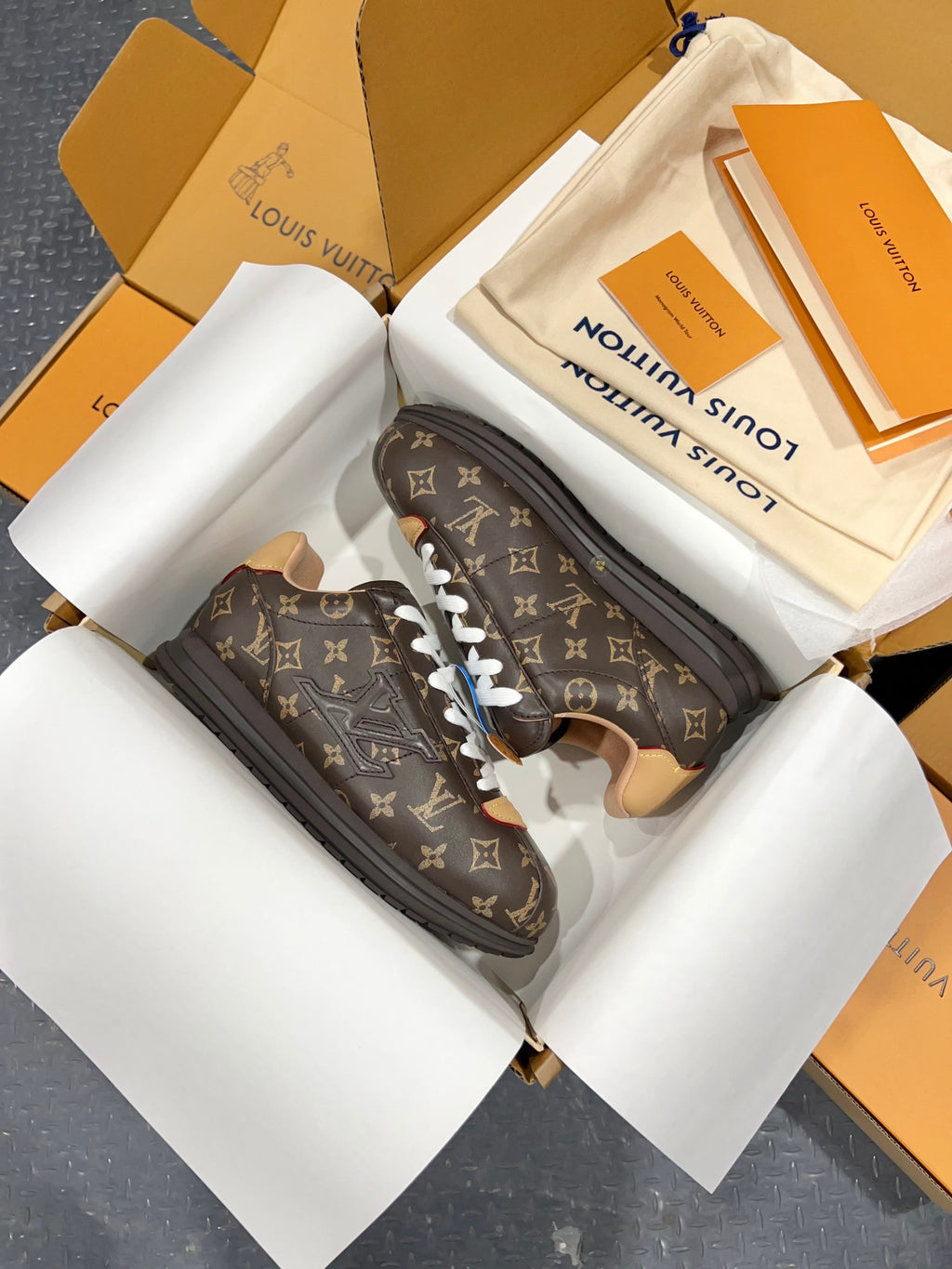 Monogram lace-up sneakers, dark brown leather with white laces and tan accents
