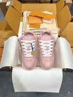 Louis Vuitton pink low-top sneakers with white laces, shown as a pair in open shoebox.
