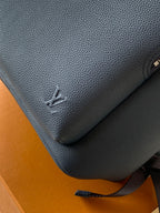 Louis Vuitton blue pebbled leather mini backpack with embossed LV logo