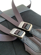 Backpack shoulder straps with metal buckles and woven webbing detail
