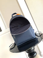 Louis Vuitton navy mini backpack with front zipper and black interior lining