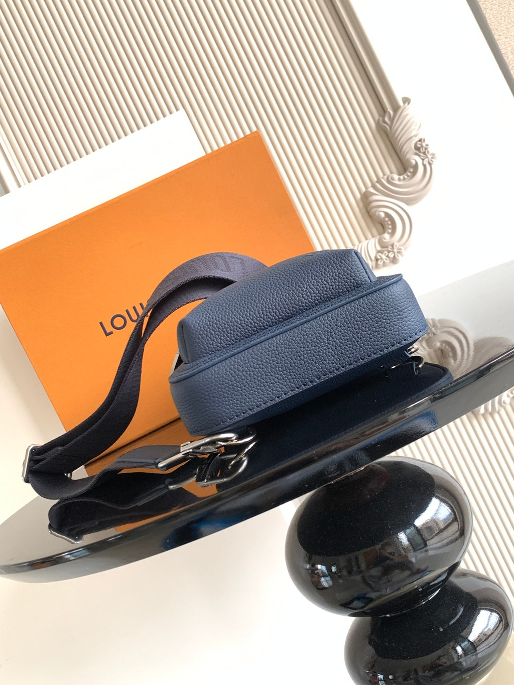 Men's crossbody bag, dark blue pebbled leather, curved flap with adjustable shoulder strap