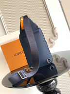 Men's crossbody bag, dark blue with front flap, strap rings, and silver-tone hardware