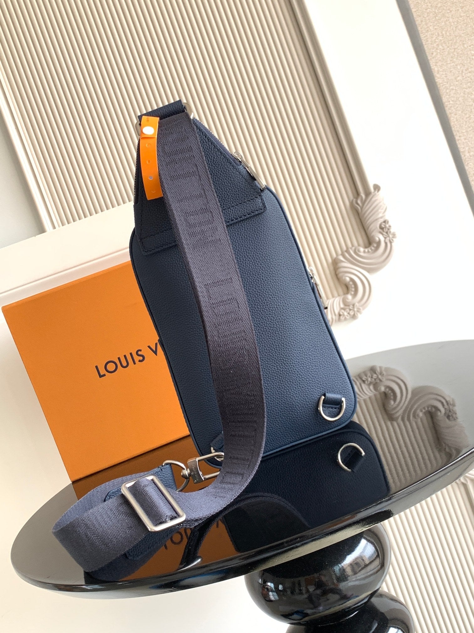 Men's crossbody bag, dark blue with front flap, strap rings, and silver-tone hardware