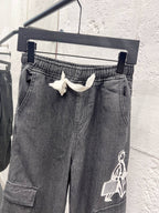Dark gray denim pants with elastic waistband and large graphic patch