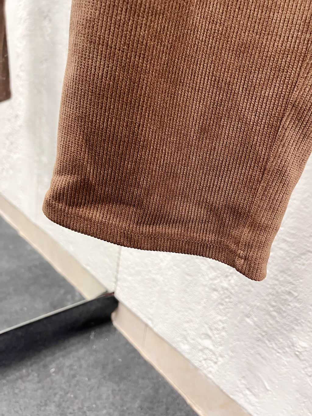 Brown corduroy pant hem with ribbed cuff detail