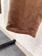 Brown corduroy pant hem with ribbed cuff detail