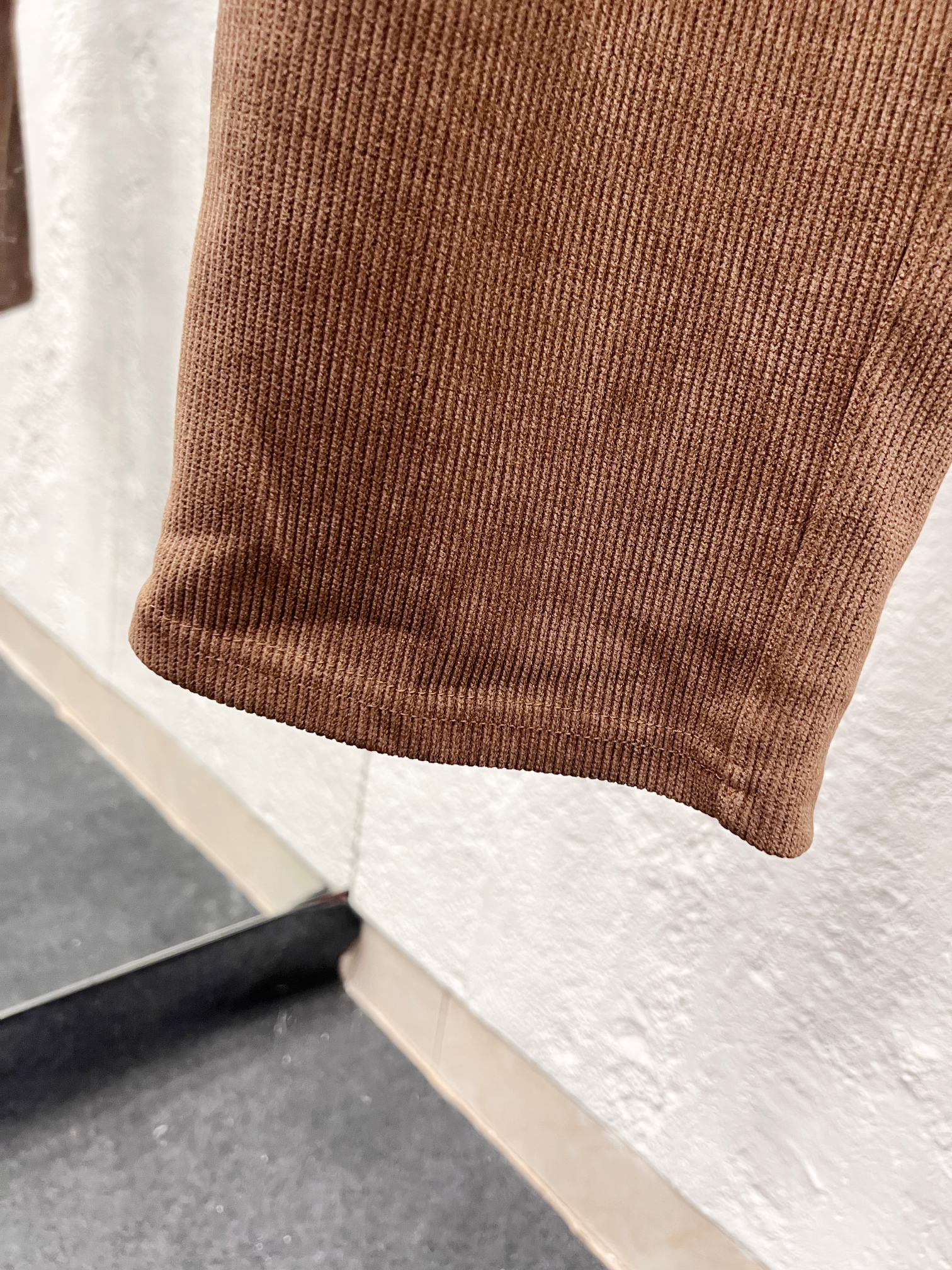 Brown corduroy pant hem with ribbed cuff detail