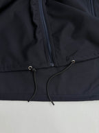 Prada long jacket dark navy with drawstring cord at front hem and zipper pocket panel