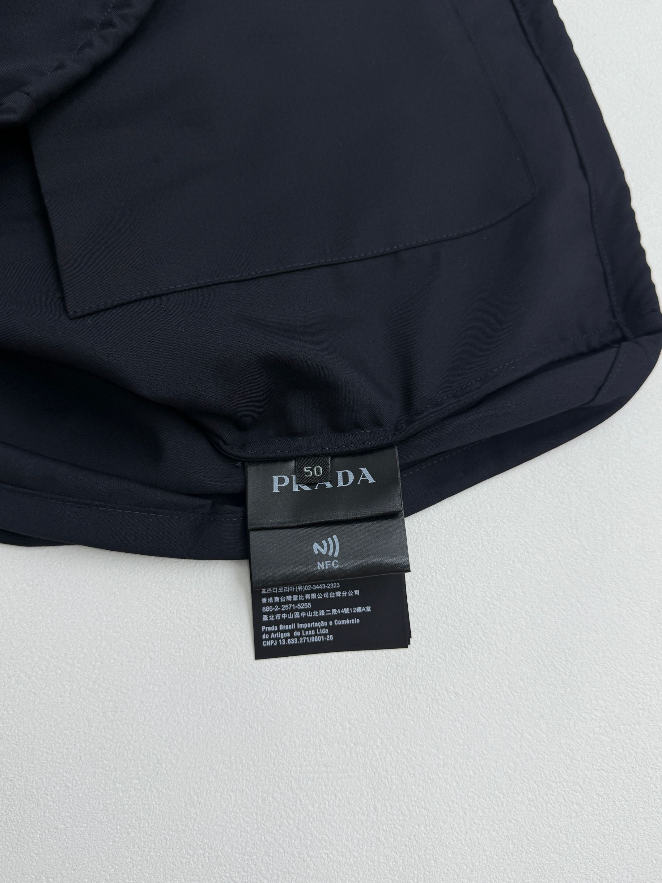 Prada long jacket dark navy interior neck label with size and care tags