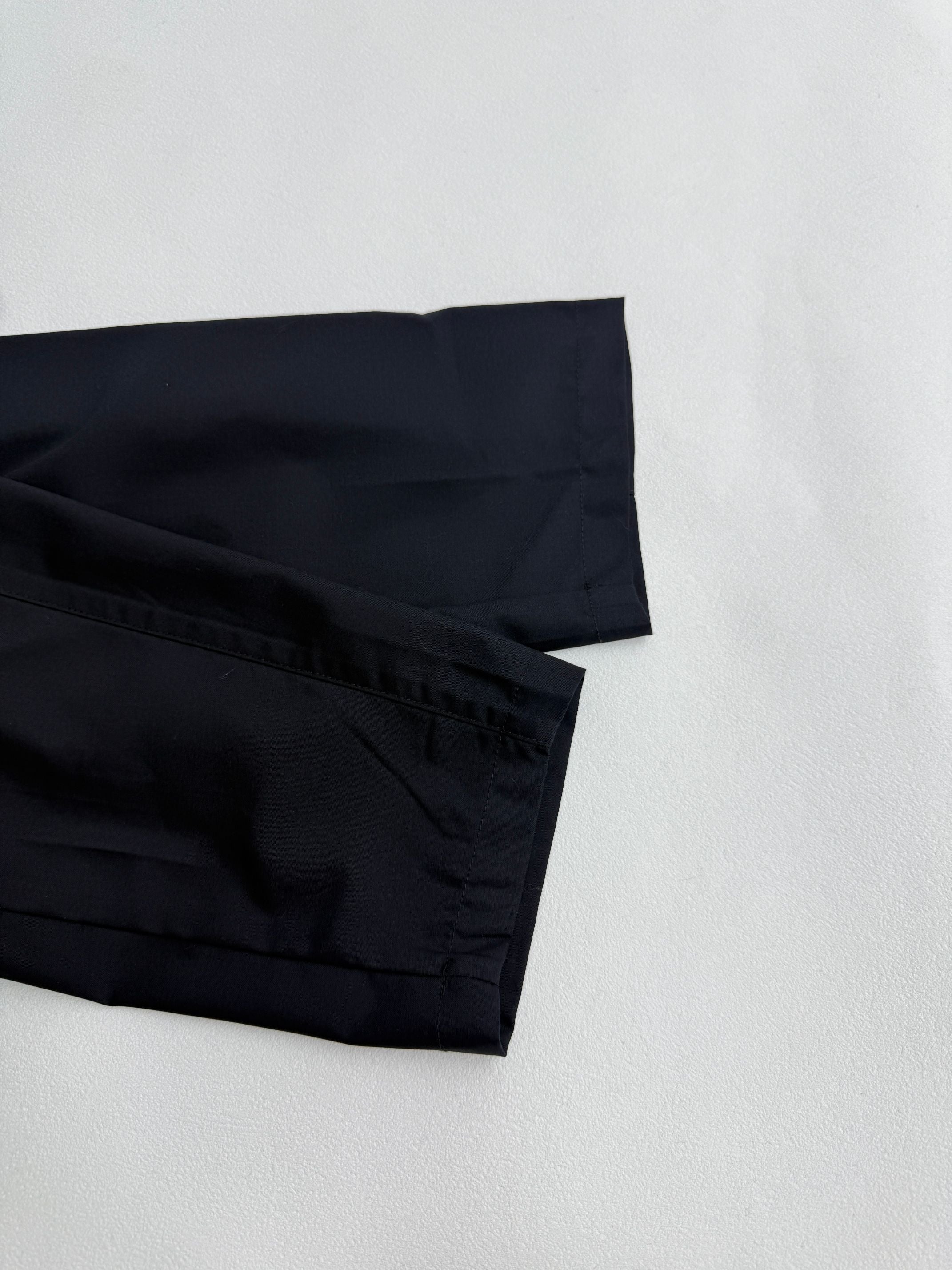 Prada long jacket dark navy lower sleeve and hem with layered stitching close-up