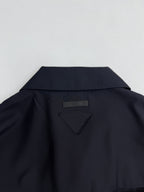 Prada long jacket dark navy back yoke with small triangular logo patch