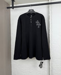 Black long-sleeve henley shirt with button placket and cross patch on the chest