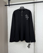 Black long-sleeve henley shirt with button placket and cross patch on the chest