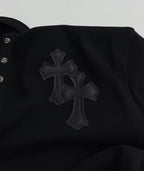 Black long-sleeve shirt with large cross appliqué on the chest