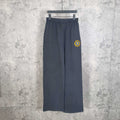 Balenciaga pants in dark navy with elastic waistband, wide straight legs, small side logo patch