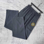 Balenciaga pants set of two in dark navy with elastic waist and logo patch, side-by-side
