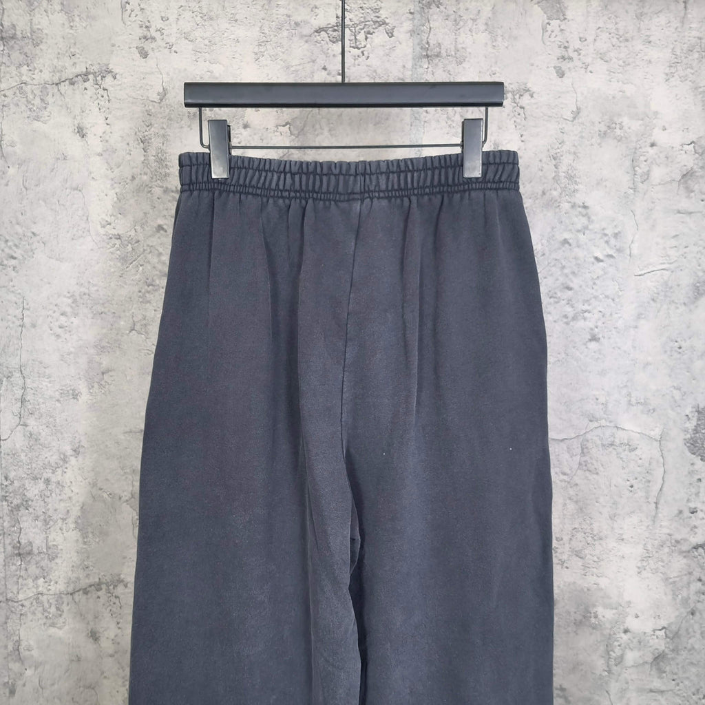 Balenciaga pants in dark navy with elastic waistband and relaxed wide legs, front view
