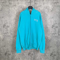 Turquoise zip-up hoodie with hood, front pocket, and Balenciaga logo on chest