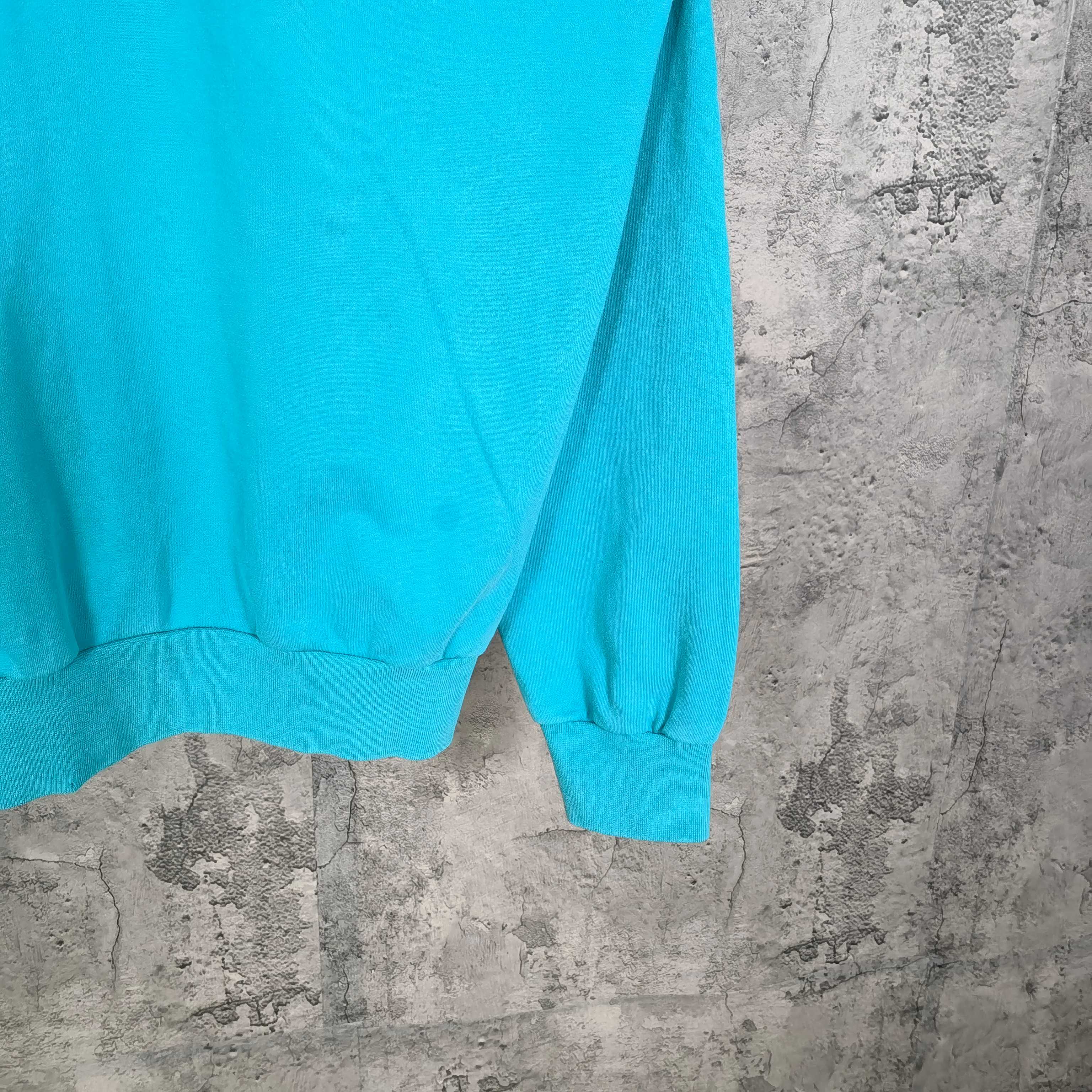 Balenciaga turquoise hoodie sleeve with ribbed cuff and hem