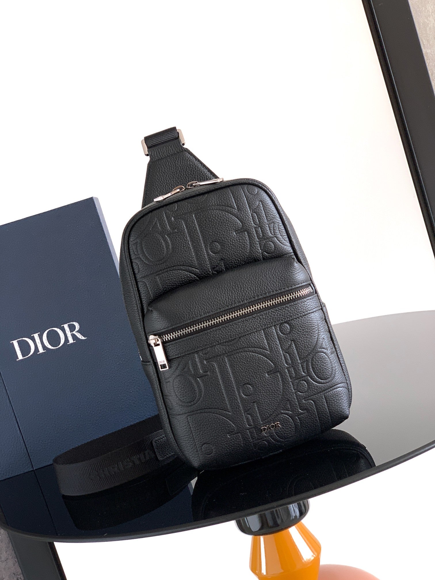 Dior mini backpack bag, black pebbled leather, monogram texture, front zip and strap