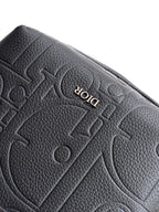 Dior men's embossed logo leather flap detail in dark color