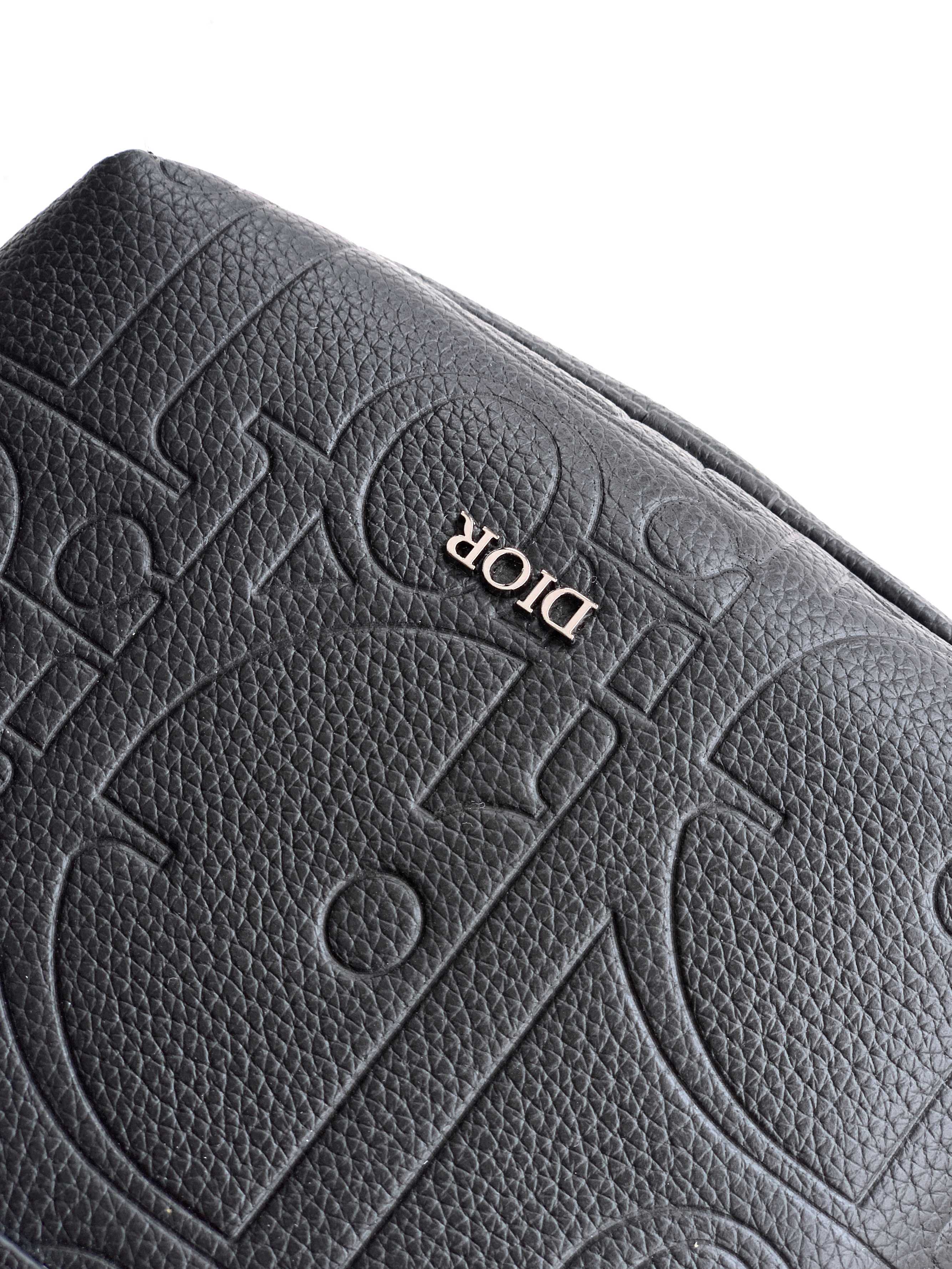 Dior men's embossed logo leather flap detail in dark color