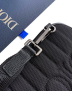 Dior men's mini bag corner with strap hardware and textured leather surface