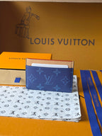 Louis Vuitton card case, blue monogram fabric with beige leather trim