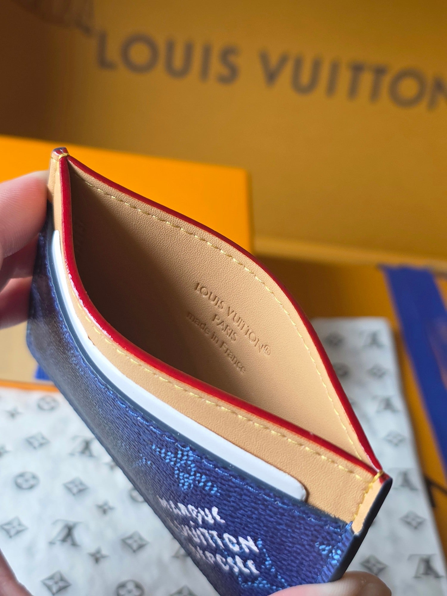 Louis Vuitton card case, blue exterior with beige interior and red edge trim