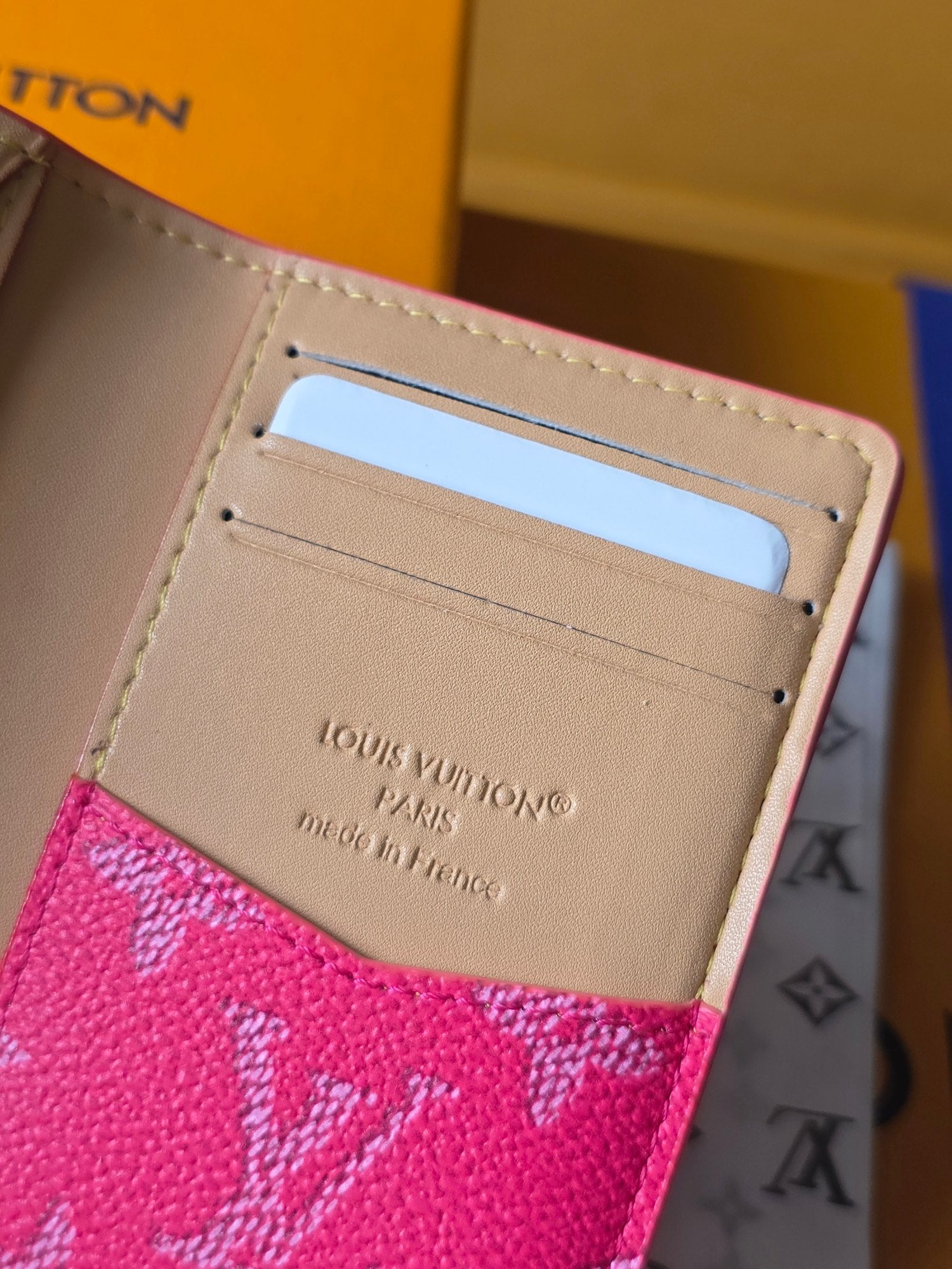 Small wallet bag interior: beige card holder with Louis Vuitton text