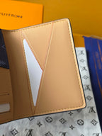 Beige Louis Vuitton small wallet bag interior with card slots and stitched seams