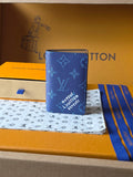 Blue Louis Vuitton small wallet bag with monogram pattern and stitched edge