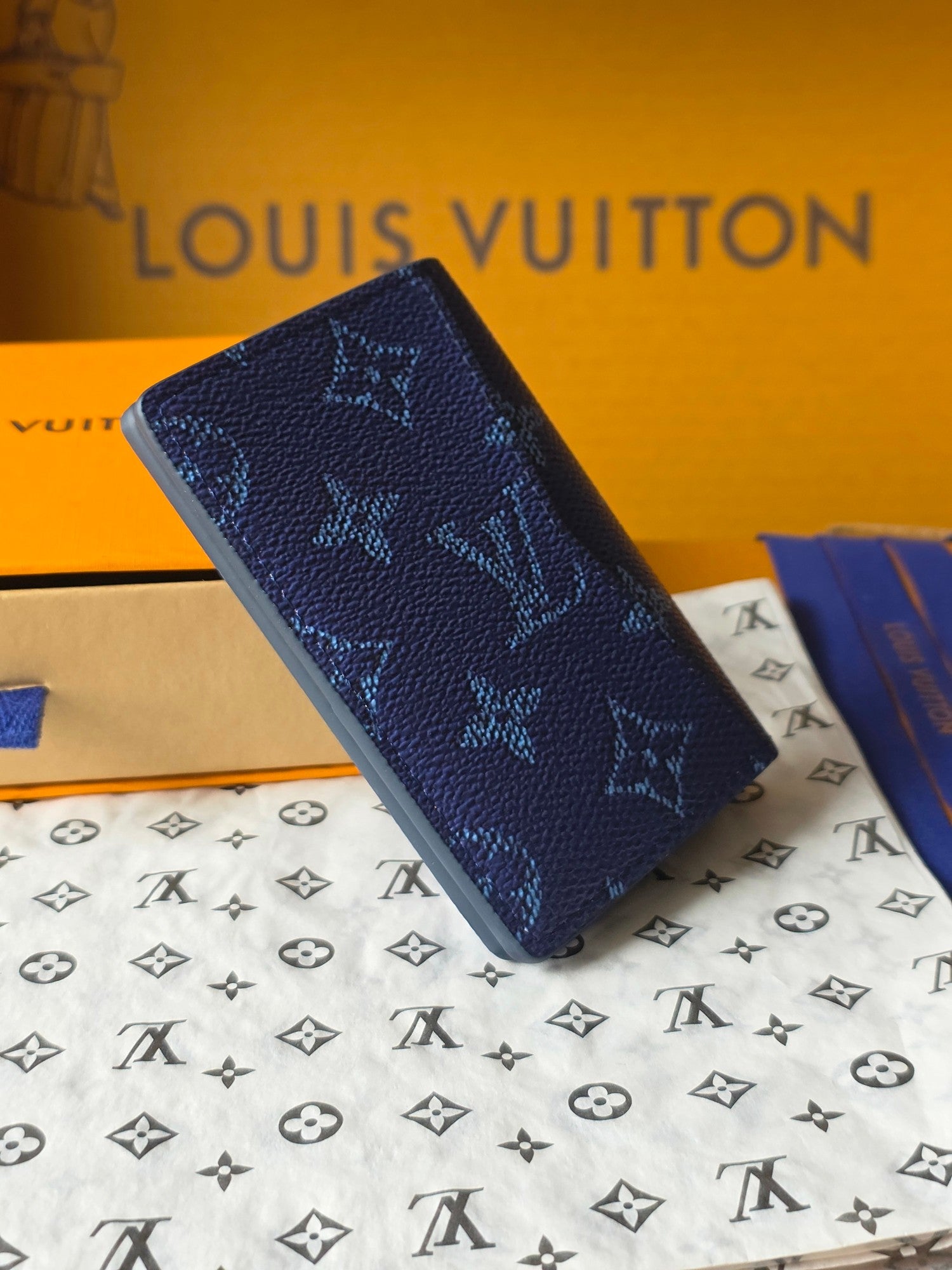 Louis Vuitton blue monogram wallet, close-up side view