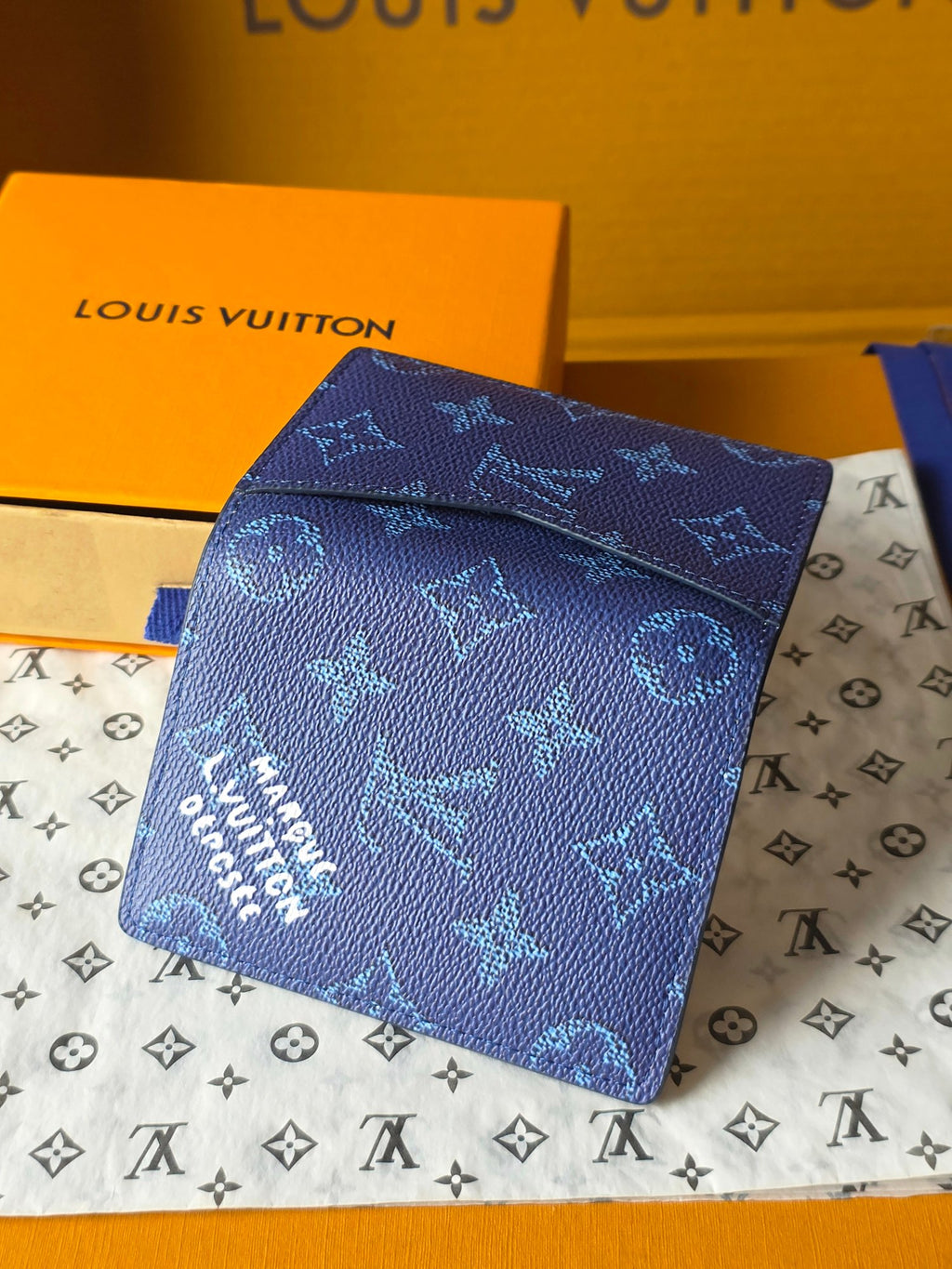 Blue Louis Vuitton small wallet bag folded closed with allover monogram
