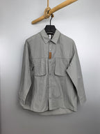 Light gray cotton jacket with button front and chest flap pockets