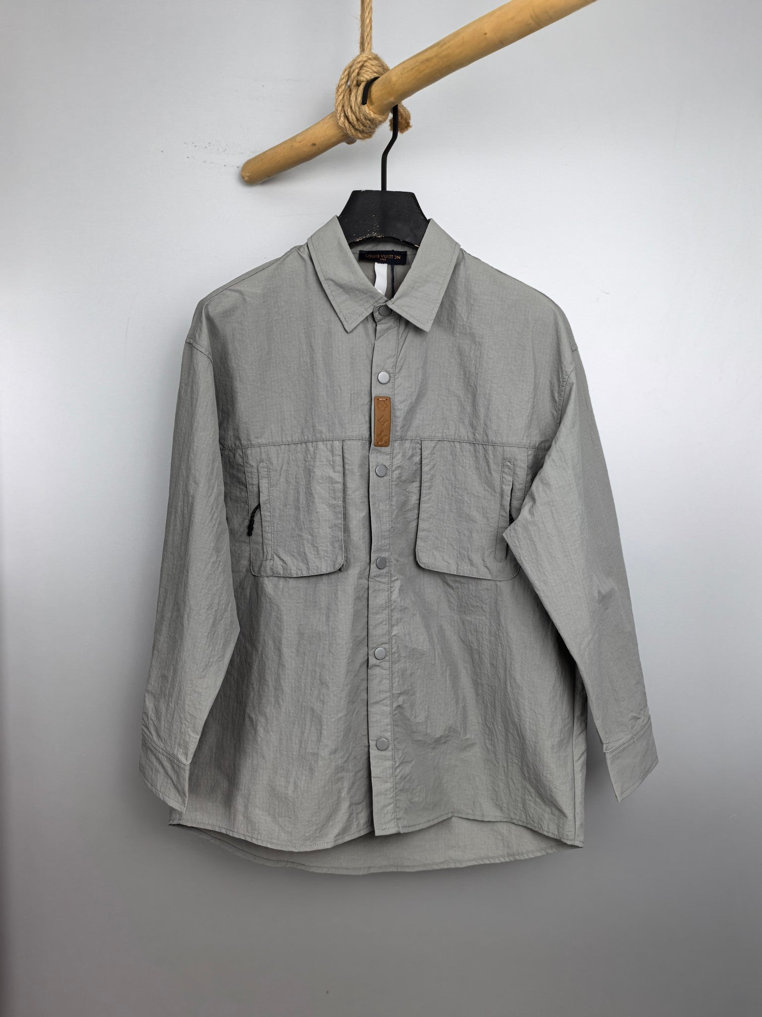 Light gray cotton jacket with button front and chest flap pockets