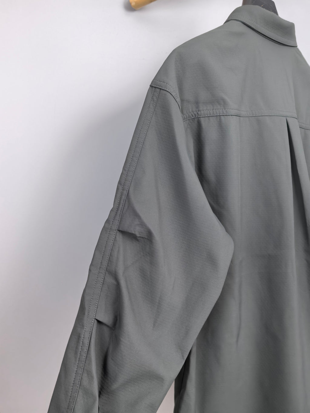 Dior long-sleeve button-up shirt side view, dark gray, relaxed shoulder yoke