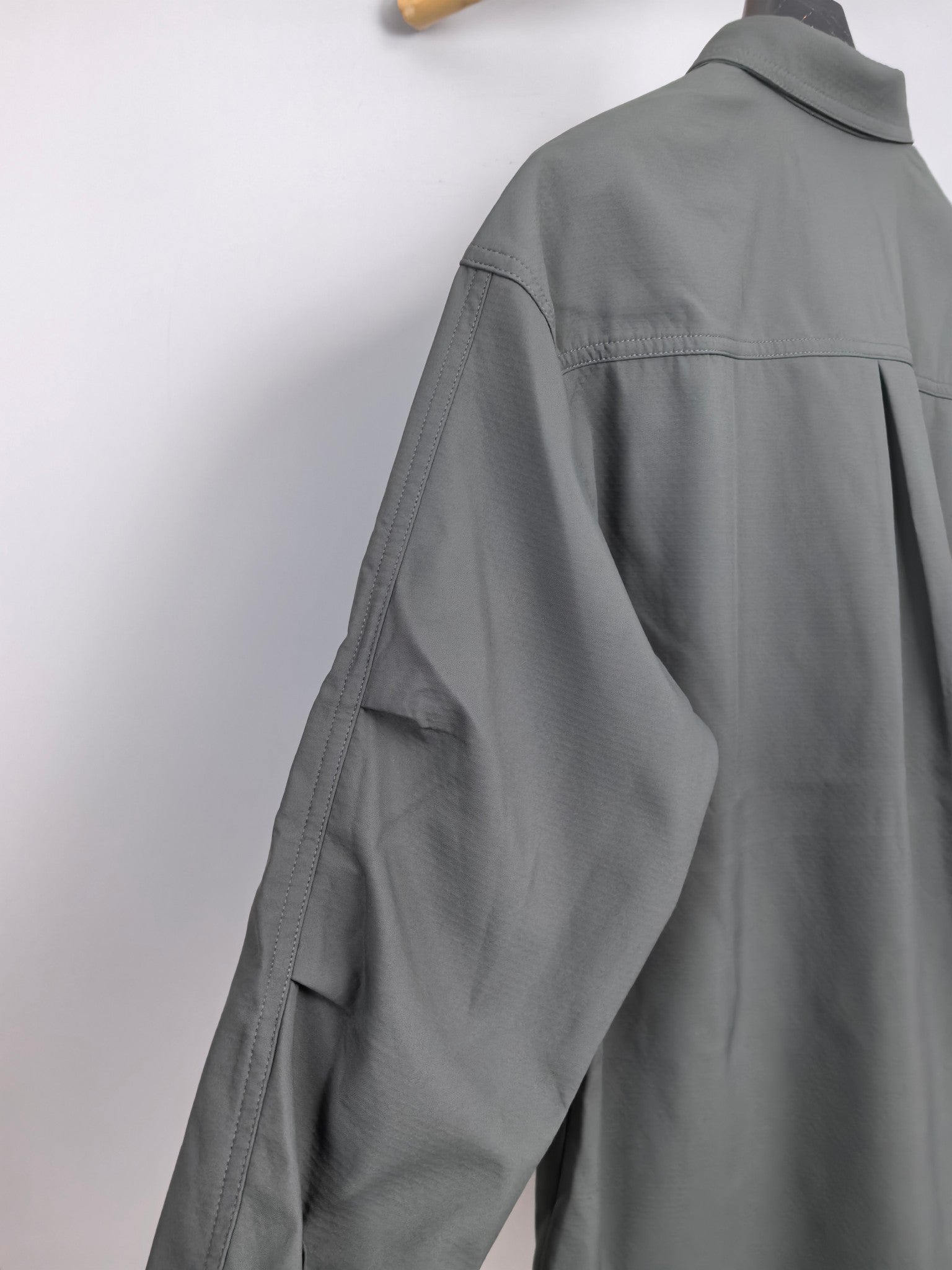Dior long-sleeve button-up shirt side view, dark gray, relaxed shoulder yoke