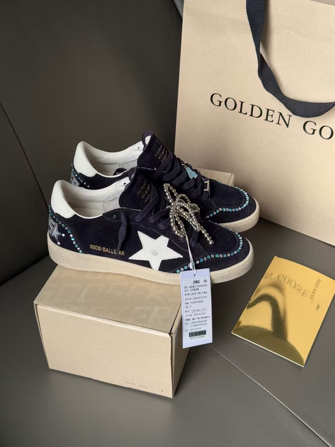 Golden Goose sneakers in dark navy with white star, lace-up with dangling metallic tie
