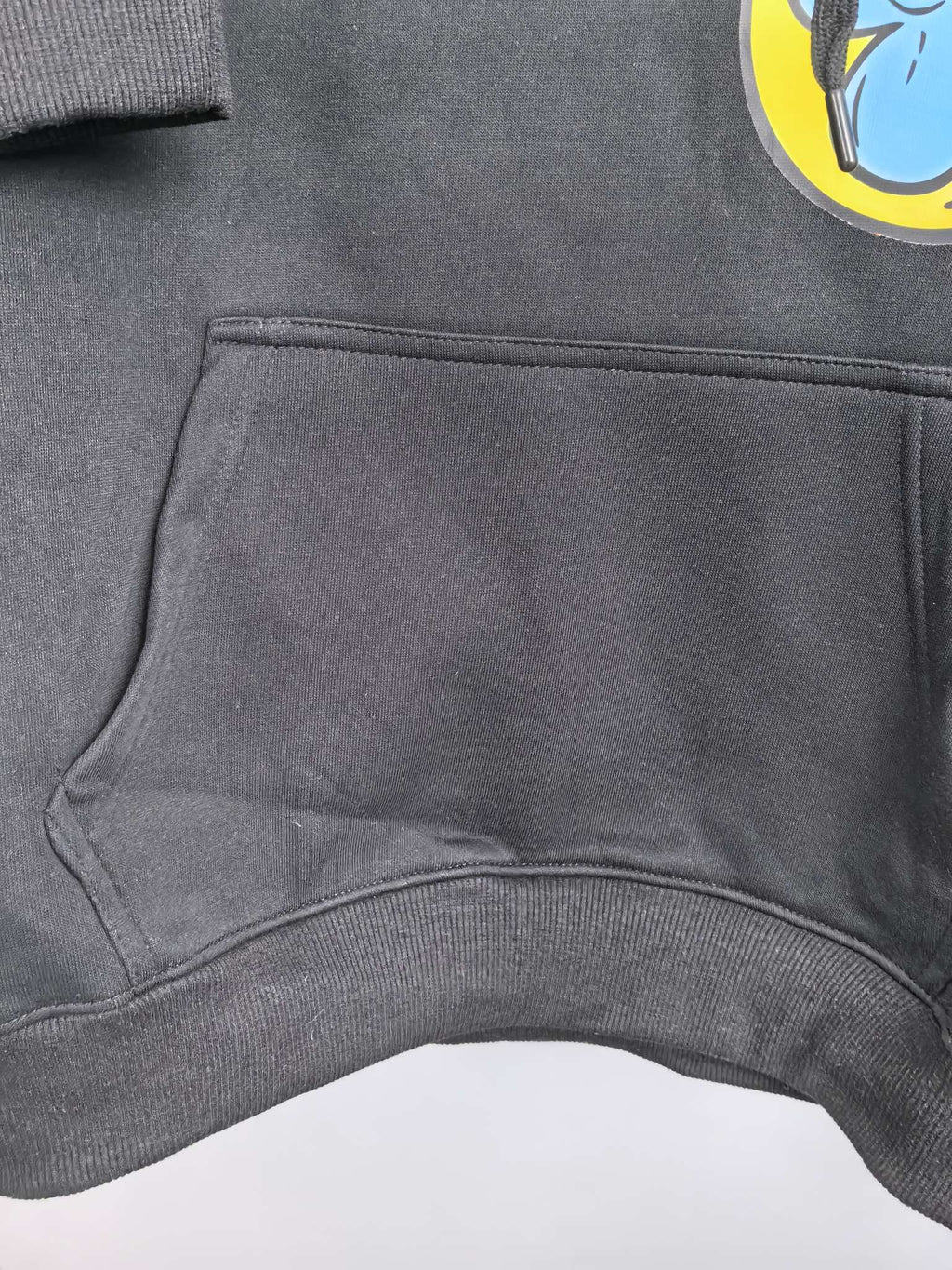 Black hoodie kangaroo pocket on the front