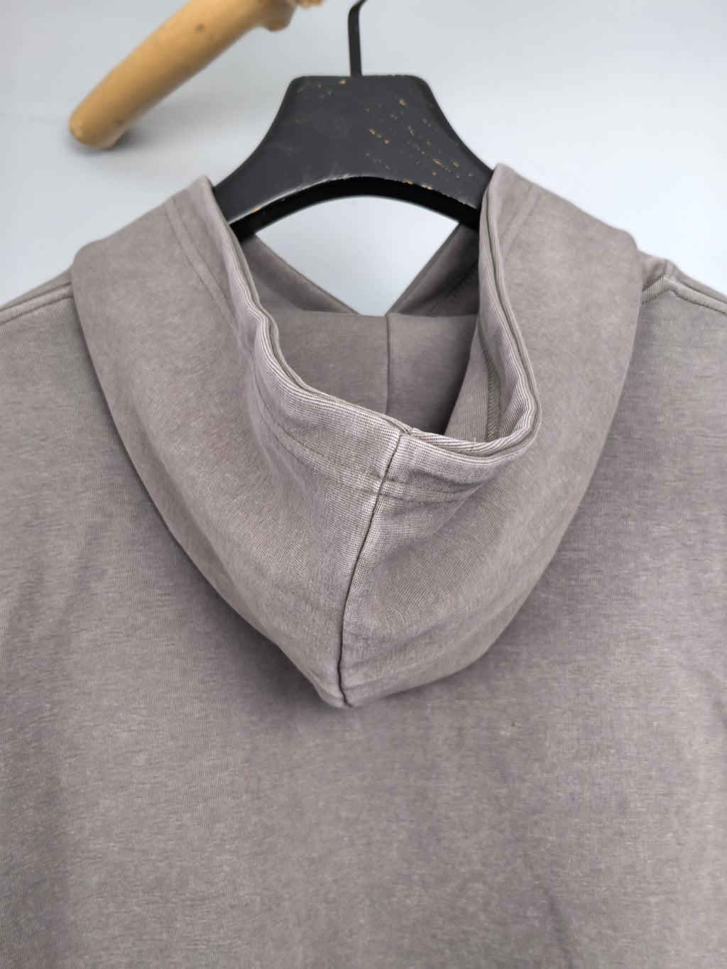 Gray hoodie with hood opening and inner lining detail